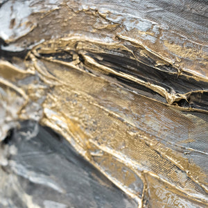 Nahaufnahme goldener und grauer Texturen auf Acryl